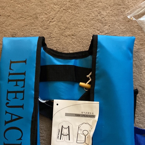 Life jacket. Never worn. New with tags. Manual inflatable jacket - Picture 3 of 13